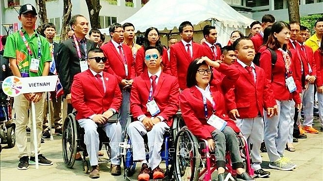 Vietnamese athletes attend the flag hoisting ceremony of the 9th ASEAN Para Games in Malaysia in 2017. Photo: VN Vietnamese athletes attend the flag hoisting ceremony of the 9th ASEAN Para Games in Malaysia in 2017. Photo: VN