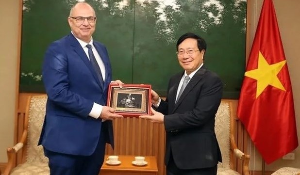 Permanent Deputy Prime Minister Pham Binh Minh (right) hosts a reception for outgoing Ambassador of Denmark Højlund Christensen on July 5. Photo: VGP Permanent Deputy Prime Minister Pham Binh Minh (right) hosts a reception for outgoing Ambassador of Denmark Højlund Christensen on July 5. Photo: VGP