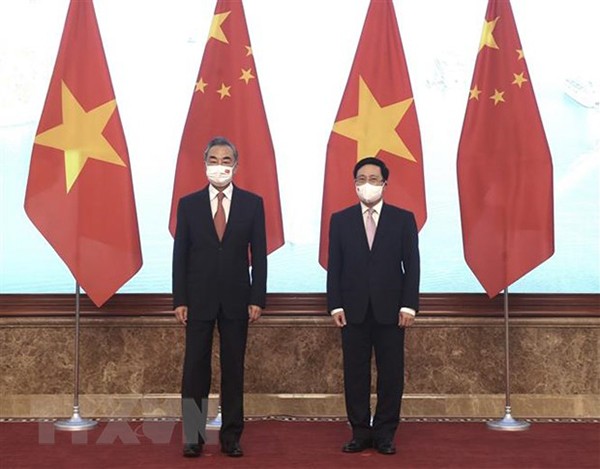 Standing Deputy Prime Minister Pham Binh Minh welcomed Chinese State Councilor and Foreign Minister Wang Yi to attend the 13th meeting of the Steering Committee for Bilateral Cooperation between Vietnam and China in September 2021 in Hanoi. Photo: Lam Khanh/VNA Standing Deputy Prime Minister Pham Binh Minh welcomed Chinese State Councilor and Foreign Minister Wang Yi to attend the 13th meeting of the Steering Committee for Bilateral Cooperation between Vietnam and China in September 2021 in Hanoi. Photo: Lam Khanh/VNA