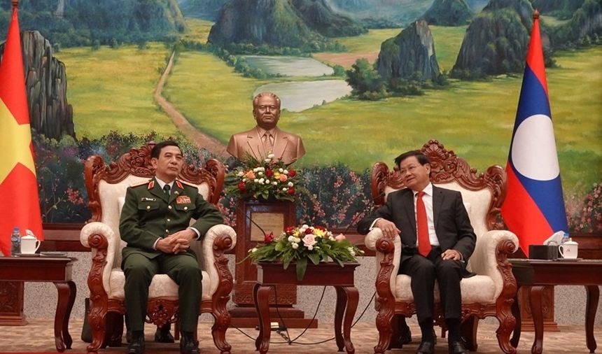 General Secretary of the Lao People’s Revolutionary Party and President of Laos Thongloun Sisoulith (R) and Minister of National Defence Gen. Phan Van Giang meet in Vientiane on September 13. Photo: PANO General Secretary of the Lao People’s Revolutionary Party and President of Laos Thongloun Sisoulith (R) and Minister of National Defence Gen. Phan Van Giang meet in Vientiane on September 13. Photo: PANO