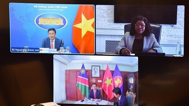 Deputy Minister of Foreign Affairs Pham Quang Hieu (upper, left) and Namibian Deputy Minister of International Relations and Cooperation Jenelly Matundu (upper, right) hold talks via videoconference on October 24. Photo: VNA Deputy Minister of Foreign Affairs Pham Quang Hieu (upper, left) and Namibian Deputy Minister of International Relations and Cooperation Jenelly Matundu (upper, right) hold talks via videoconference on October 24. Photo: VNA