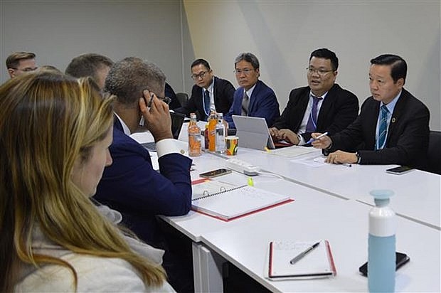 At the working session between Minister of Natural Resources and Environment Tran Hong Ha (R) and President for COP26 Alok Sharma. (Photo: VNA) At the working session between Minister of Natural Resources and Environment Tran Hong Ha (R) and President for COP26 Alok Sharma. (Photo: VNA)