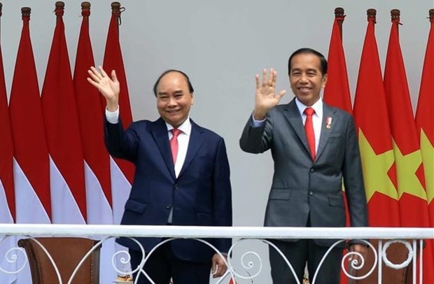 President Nguyen Xuan Phuc (L) and his Indonesian counterpart Joko Widodo at the welcome ceremony in Bogor city on December 22. Photo: VNA President Nguyen Xuan Phuc (L) and his Indonesian counterpart Joko Widodo at the welcome ceremony in Bogor city on December 22. Photo: VNA