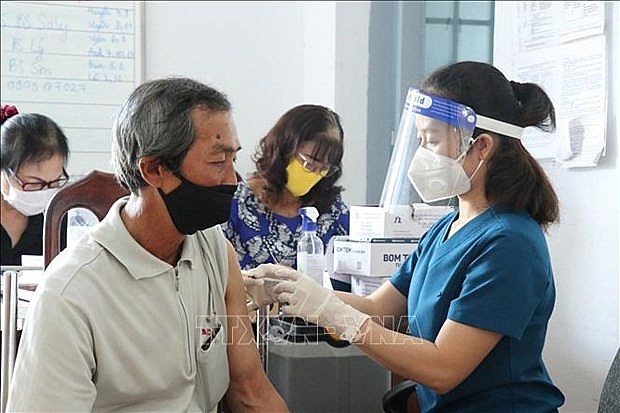 A man gets vaccinated against Covid-19. Photo: VNA A man gets vaccinated against Covid-19. Photo: VNA
