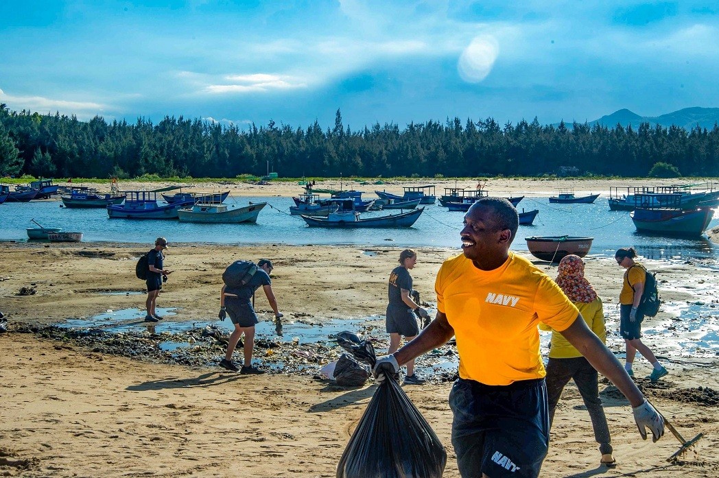 Members of the US Navy, Royal Navy, Australian Defence Force, and Vietnamese volunteers participate in a clean-up session at Vung Lam Beach during Pacific Partnership 2022. Source: US embassy in Vietnam Members of the US Navy, Royal Navy, Australian Defence Force, and Vietnamese volunteers participate in a clean-up session at Vung Lam Beach during Pacific Partnership 2022. Source: US embassy in Vietnam