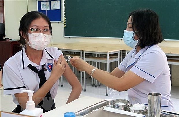 the total number of doses of COVID-19 vaccines injected rises to 265,519,661. Photo: VNA) the total number of doses of COVID-19 vaccines injected rises to 265,519,661. Photo: VNA)