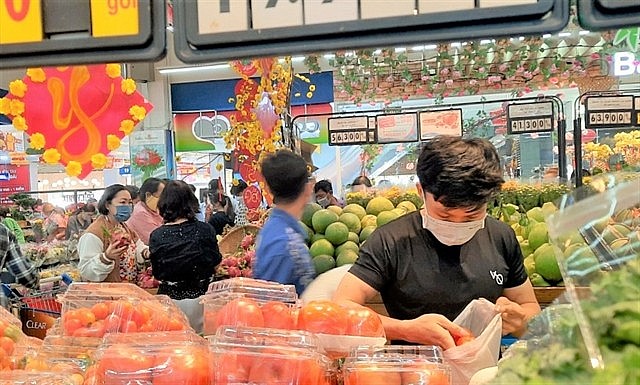 Customers shop at a Co.opmart supermarket in HCM City. Photo courtesy of Saigon Co.op Customers shop at a Co.opmart supermarket in HCM City. Photo courtesy of Saigon Co.op