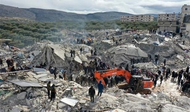 Rescuers and volunteers search for victims and survivors trapped in the rubble after a strong earthquake in the village of Besnia, near the town of Harim, Idlib province Syria, bordering Turkey. Photo: AFP Rescuers and volunteers search for victims and survivors trapped in the rubble after a strong earthquake in the village of Besnia, near the town of Harim, Idlib province Syria, bordering Turkey. Photo: AFP