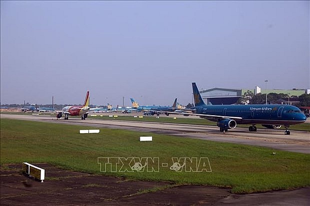 Nhập mPlanes are seen at Noi Bai International Airport in Ha Noi. (Photo: VNA) Nhập mPlanes are seen at Noi Bai International Airport in Ha Noi. (Photo: VNA)