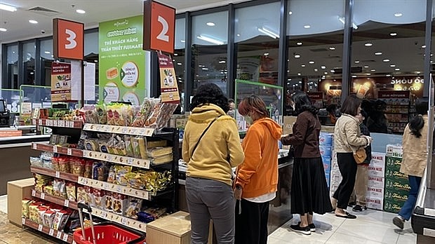 People shop at a supermarket in Hanoi. (Photo: VNA) People shop at a supermarket in Hanoi. (Photo: VNA)