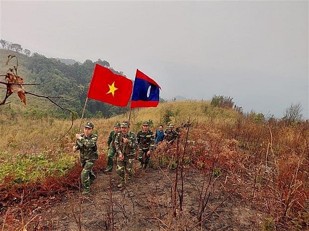 The two sides patrol the border from Marker No 119 to Marker No 121 along the Vietnam-Laos borderline. (Photo: VNA) The two sides patrol the border from Marker No 119 to Marker No 121 along the Vietnam-Laos borderline. (Photo: VNA)
