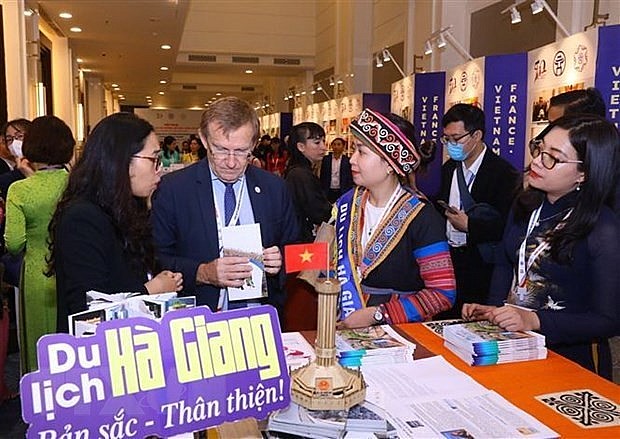Participants at the conference are told about Vietnamese localities. (Photo: VNA) Participants at the conference are told about Vietnamese localities. (Photo: VNA)
