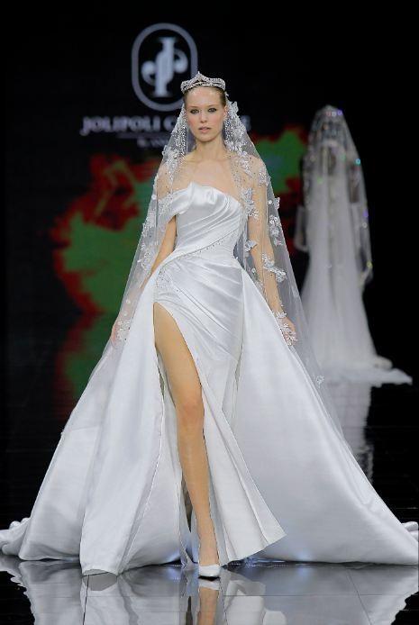 The local designer uses a draping technique and 3D flower sculpting on silk and chiffon to create outfits. The local designer uses a draping technique and 3D flower sculpting on silk and chiffon to create outfits.