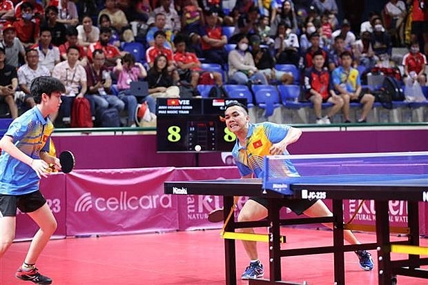 Table tennist players Dinh Anh Hoang (right) and Tran Mai Ngoc at the SEA Games 32. (Photo: VNA) Table tennist players Dinh Anh Hoang (right) and Tran Mai Ngoc at the SEA Games 32. (Photo: VNA)