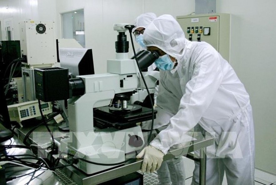Workers at a microchip laboratory in the Saigon Hi-Tech Park in Ho Chi Minh City. Workers at a microchip laboratory in the Saigon Hi-Tech Park in Ho Chi Minh City.