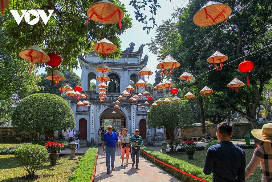 Foreigners visit Van Mieu - Quoc Tu Giam, the first university in Vietnam, in Hanoi capital. Foreigners visit Van Mieu - Quoc Tu Giam, the first university in Vietnam, in Hanoi capital.