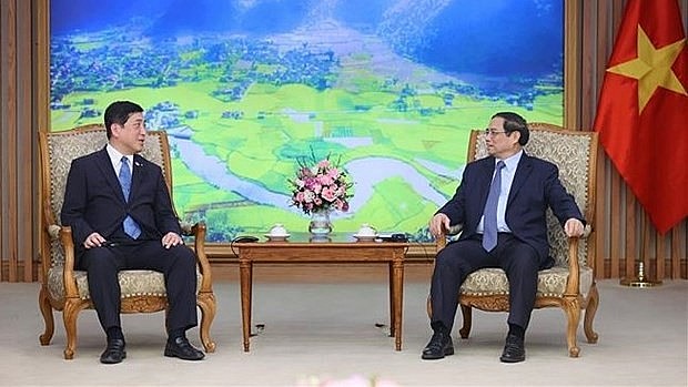 Prime Minister Pham Minh Chinh (R) and visiting Governor of Japan’s Kagoshima prefecture Shiota Koichi at their meeting in Hanoi on July 10. (Photo: VNA) Prime Minister Pham Minh Chinh (R) and visiting Governor of Japan’s Kagoshima prefecture Shiota Koichi at their meeting in Hanoi on July 10. (Photo: VNA)