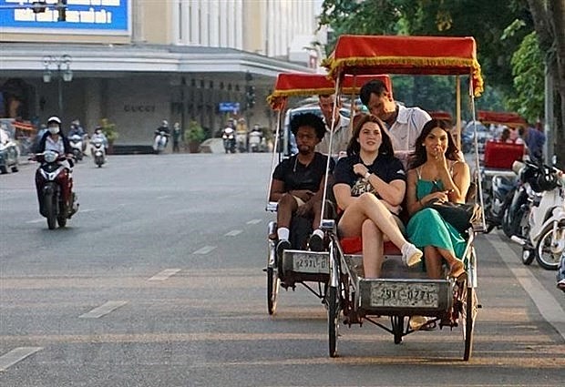Foreign visitors enjoy a Hanoi Among 21 Best Winter Vacations: U.S. News & World Report