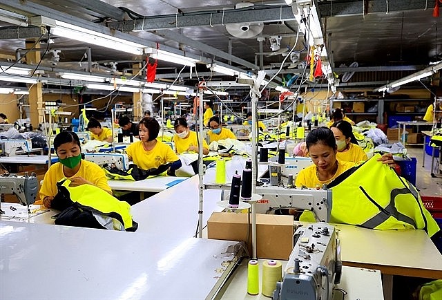 A garment and textile production line at Dony Garment Company Ltd in HCM City. The garment and textile industry will work towards efficient use of resources and waste reduction. Photo: VNA A garment and textile production line at Dony Garment Company Ltd in HCM City. The garment and textile industry will work towards efficient use of resources and waste reduction. Photo: VNA