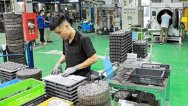 Automobile components are made at foreign-invested Pim Vina Ltd Co, Ltd in My Trung industrial park, My Loc district, Nam Dinh province. (Photo: VNA) Automobile components are made at foreign-invested Pim Vina Ltd Co, Ltd in My Trung industrial park, My Loc district, Nam Dinh province. (Photo: VNA)