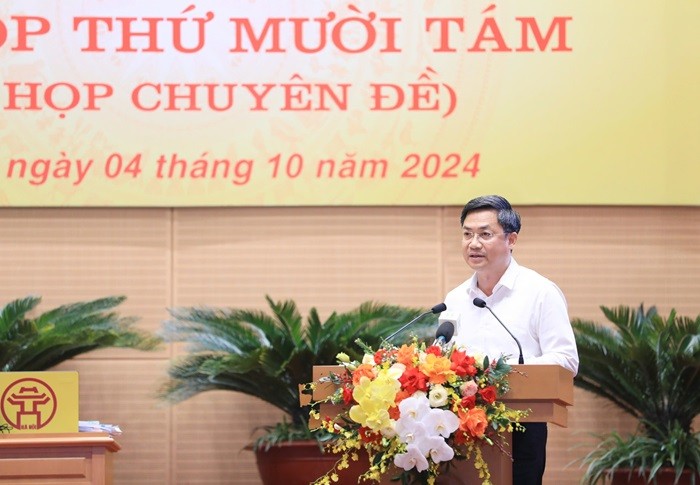 Phó Chủ tịch UBND Thành phố Hà Minh Hải trình bày Tờ trình (Ảnh: T.L). Phó Chủ tịch UBND Thành phố Hà Minh Hải trình bày Tờ trình (Ảnh: T.L).