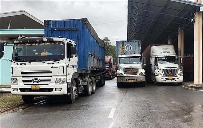Freight vehicles await customs clearance at Lao Bao International Border Gate in Quang Tri province. (Photo: VNA) Freight vehicles await customs clearance at Lao Bao International Border Gate in Quang Tri province. (Photo: VNA)