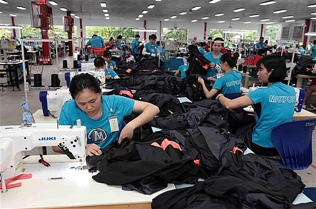 Producing apparel for export at a factory in Nam Dinh Province. Photo: VNS Producing apparel for export at a factory in Nam Dinh Province. Photo: VNS