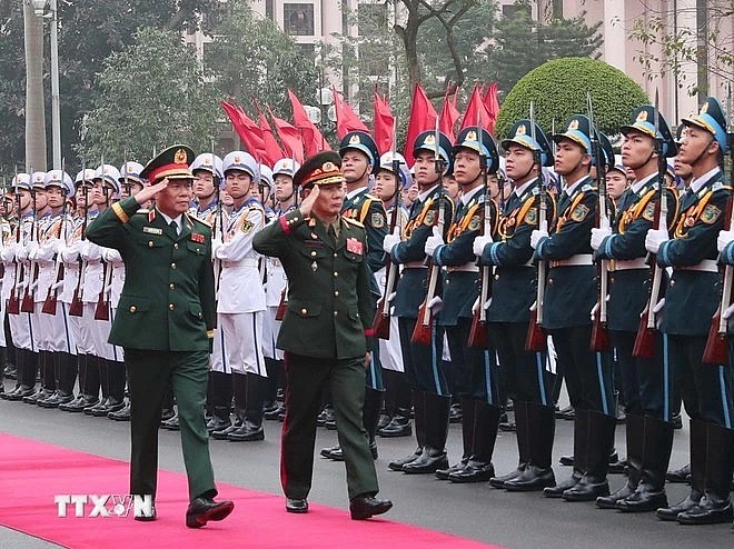 General Nguyen Tan Cuong (left), Chief of the General Staff of the Vietnam People’s Army, and Lieutenant General Saichay Kommasith, Deputy Minister of National Defence and Chief of General Staff of the Lao People's Army, review the Guard of Honor of the Vietnam People's Army at the welcome ceremony for the Lao official in Hanoi on March 5. (Photo: VNA) General Nguyen Tan Cuong (left), Chief of the General Staff of the Vietnam People’s Army, and Lieutenant General Saichay Kommasith, Deputy Minister of National Defence and Chief of General Staff of the Lao People's Army, review the Guard of Honor of the Vietnam People's Army at the welcome ceremony for the Lao official in Hanoi on March 5. (Photo: VNA)