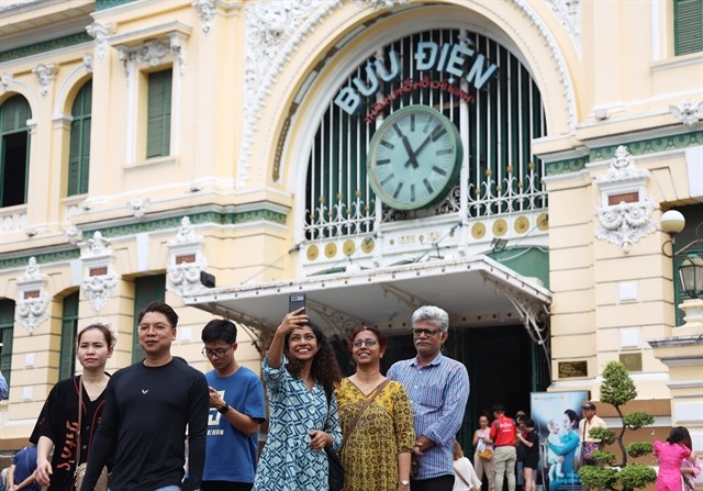 Groups of tourists visiting Saigon Central Post Office in District 1, HCM City. Groups of tourists visiting Saigon Central Post Office in District 1, HCM City.