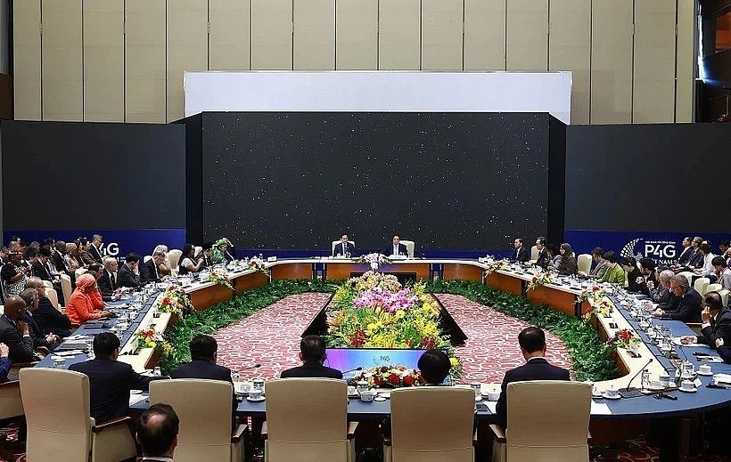 At a high-level discussion of the P4G Summit (Photo: VNA) At a high-level discussion of the P4G Summit (Photo: VNA)