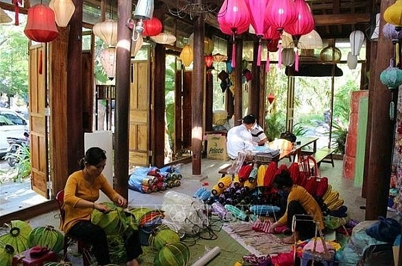 Locals produce lanterns in Hoi An ancient town. Locals produce lanterns in Hoi An ancient town.