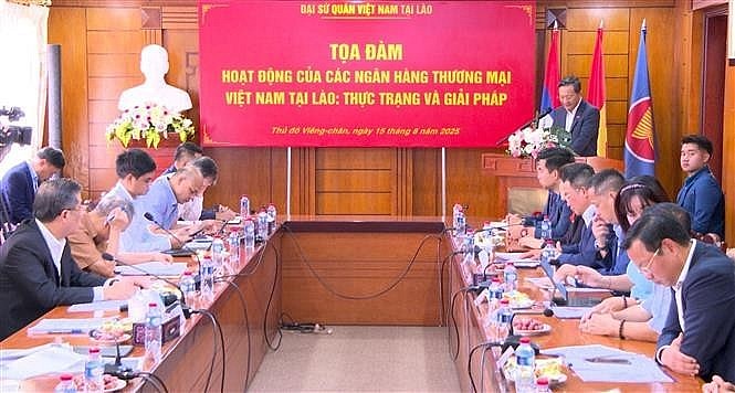 An overview of the seminar to look into operations of Vietnamese banks in Laos. (Photo: VNA) An overview of the seminar to look into operations of Vietnamese banks in Laos. (Photo: VNA)