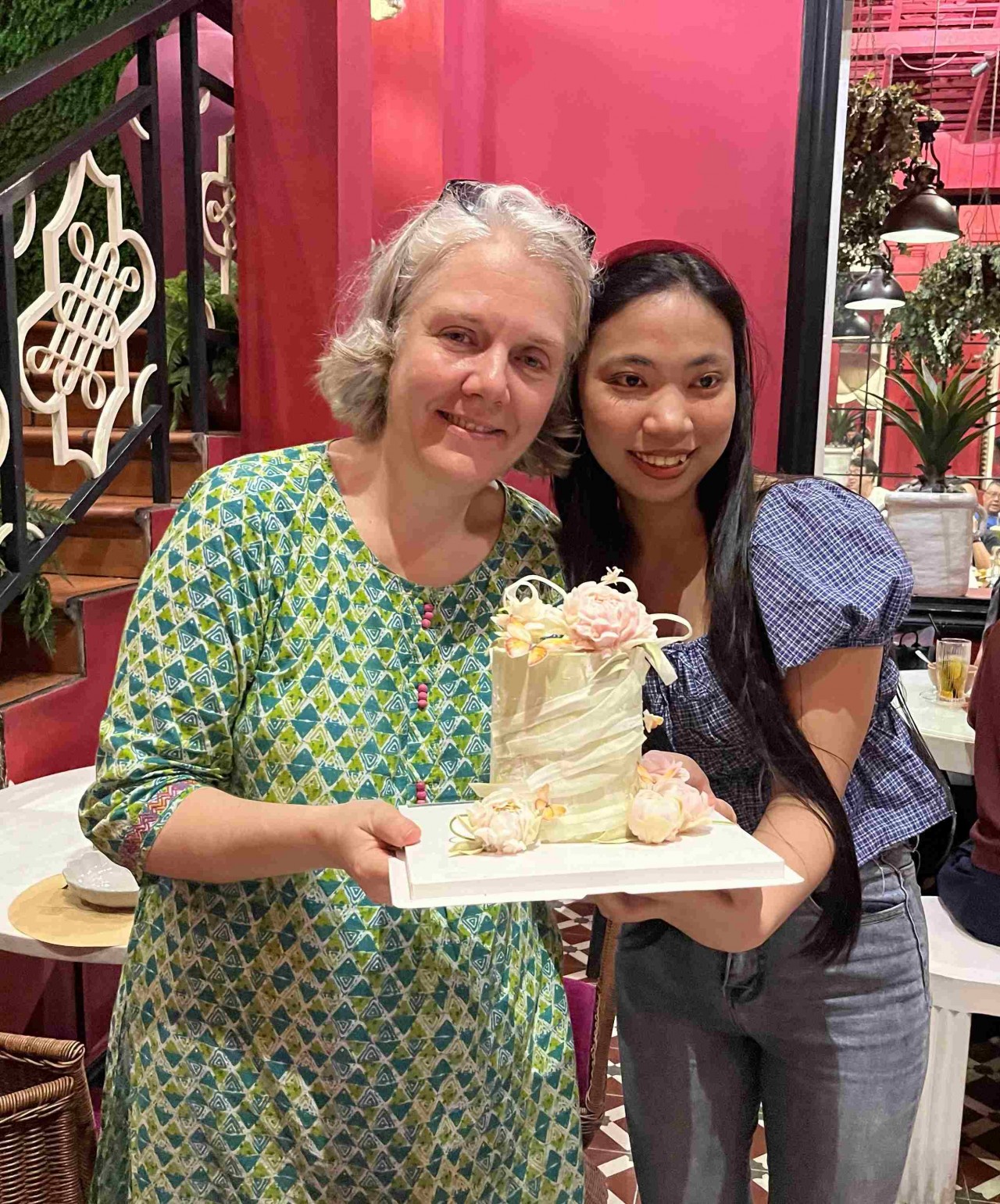 Florence Cavalier (left) receives a special gift - a cake made by a young woman once supported by EPVN. (Photo: Provided by the family) Florence Cavalier (left) receives a special gift - a cake made by a young woman once supported by EPVN. (Photo: Provided by the family)