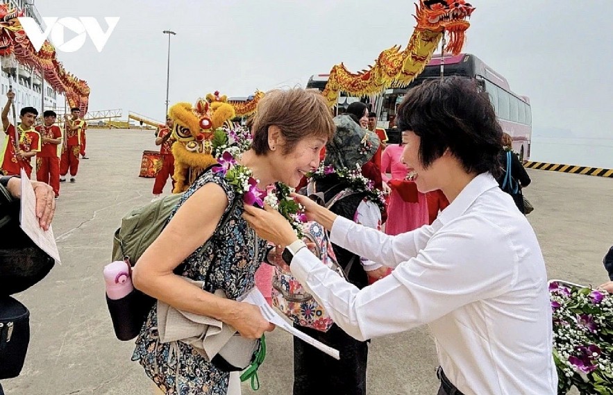 Japanese tourist is welcomed upon arrival at Ha Long Port.