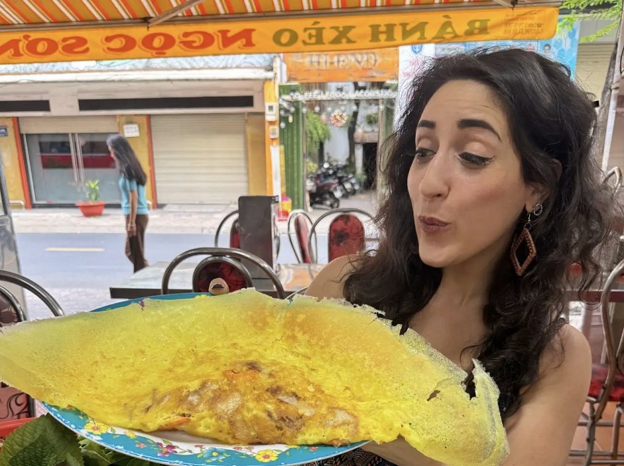Sophie Steiner enjoys Bánh xèo, also known as Vietnamese crêpe, in Ho Chi Minh City (Photo: Sophie Steiner/Business Insider)