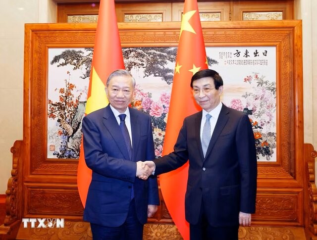 General Secretary of the Communist Party of Viet Nam (CPV) Central Committee and President of Viet Nam To Lam meets with Chairman of the National Committee of the Chinese People's Political Consultative Conference (CPPCC) Wang Huning in Beijing, China. April 14, 2026.