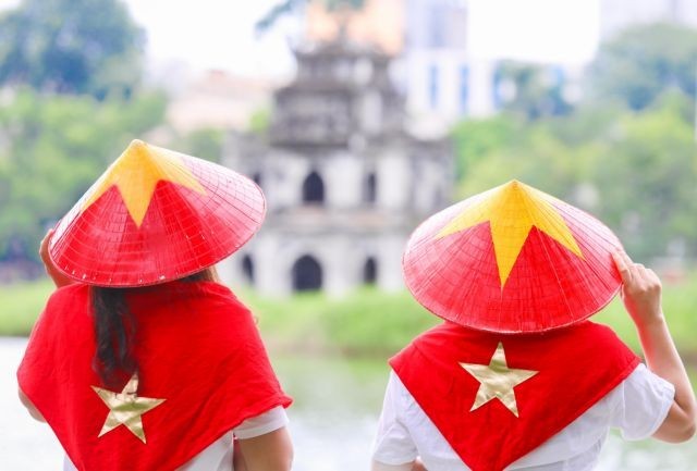 People pose for photos during the National Day holiday around Hoan Kiem Lake in Hanoi last year. People pose for photos during the National Day holiday around Hoan Kiem Lake in Hanoi last year.