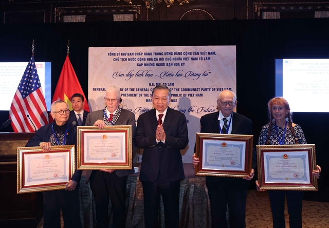 General Secretary and President Tô Lâm presented Friendship Orders to several American friends. VNA/VNS Photo General Secretary and President Tô Lâm presented Friendship Orders to several American friends. VNA/VNS Photo