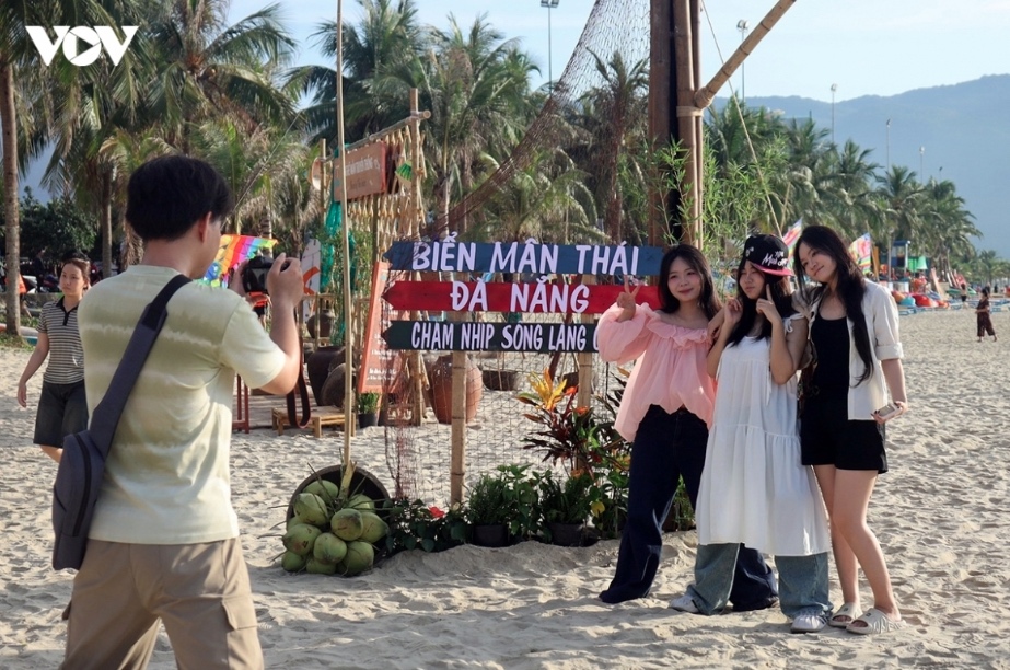 Visitors enjoy Man Thai beach in Da Nang. Visitors enjoy Man Thai beach in Da Nang.