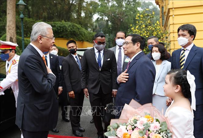 Thủ tướng Phạm Minh Chính chủ trì Lễ đón Thủ tướng Malaysia Chú thích ảnh