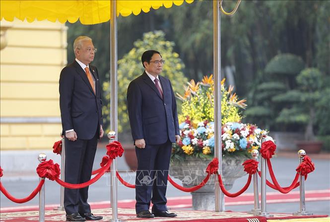 Thủ tướng Phạm Minh Chính chủ trì Lễ đón Thủ tướng Malaysia Chú thích ảnh