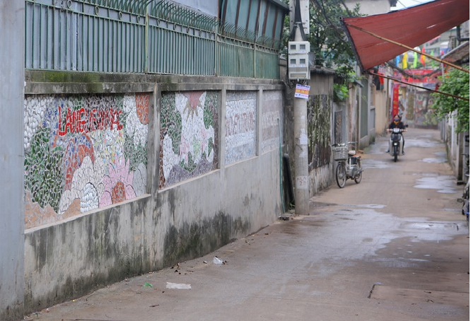 Colorful village road created by discarded bottles and scrap Colorful village road created by discarded bottles and scrap