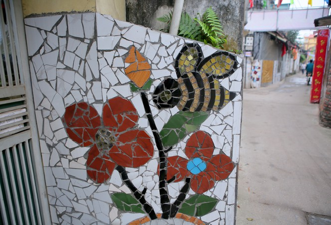 Colorful village road created by discarded bottles and scrap Colorful village road created by discarded bottles and scrap