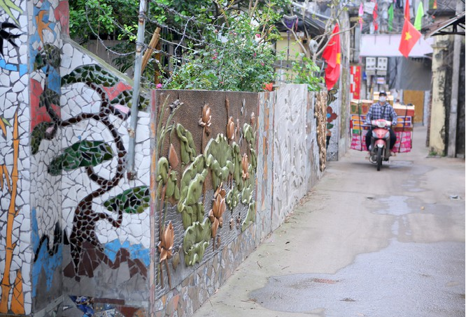Colorful village road created by discarded bottles and scrap Colorful village road created by discarded bottles and scrap