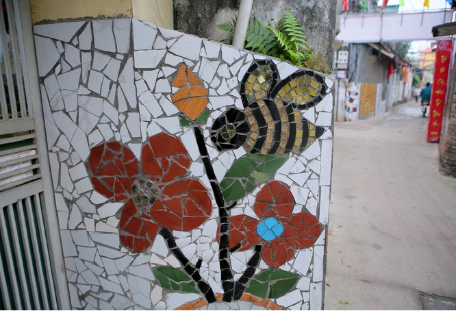 Colorful village road created by discarded bottles and scrap Colorful village road created by discarded bottles and scrap