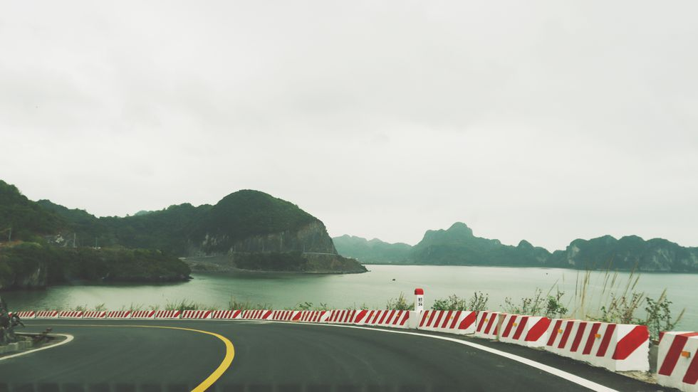 coastal road in cat ba island a not to be missed destination for backpackers