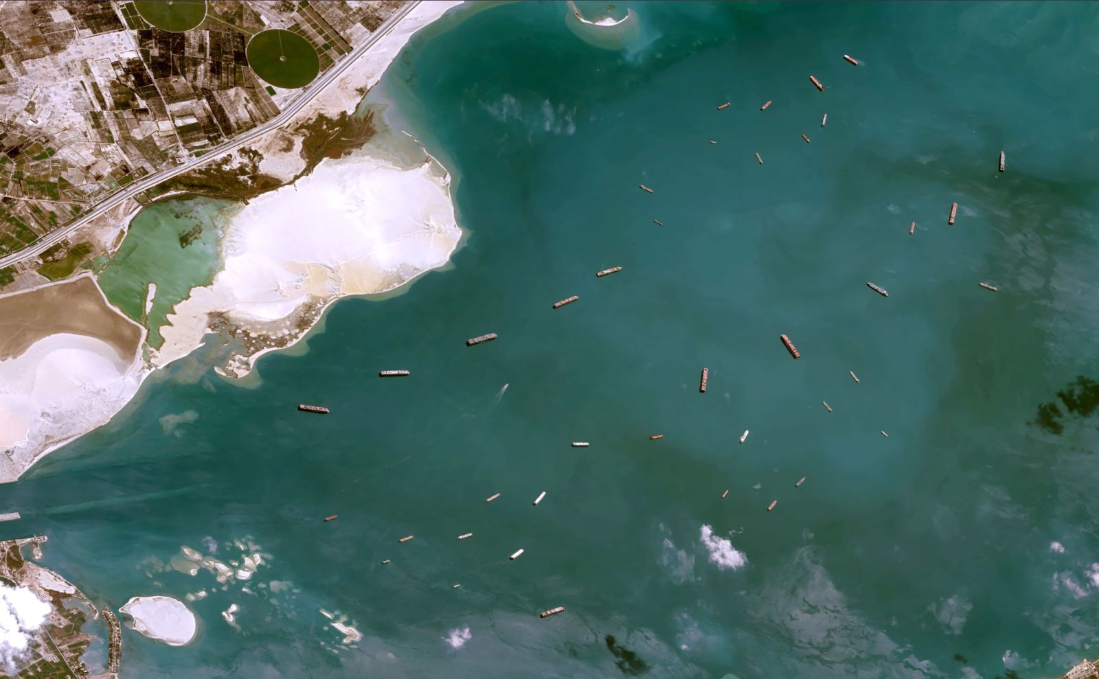 Giant container ship stuck is causing traffic jam on Suez Canal 1001-suez-canal-blocked-by-a-giant-container