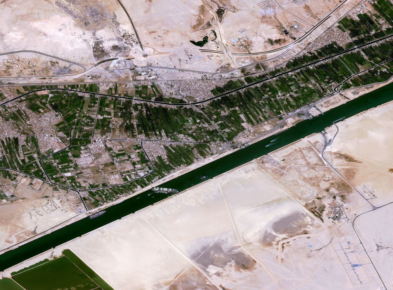 Giant container ship stuck is causing traffic jam on Suez Canal 1432-suez-canal-blocked-by-a-giant-container