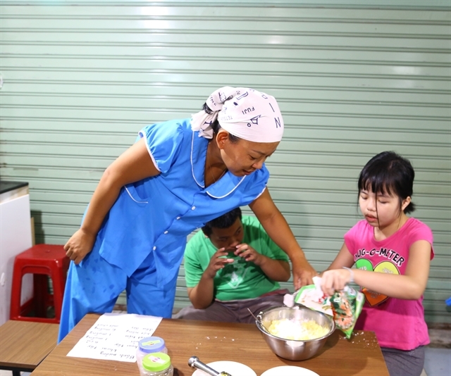 Japanese teacher bridges gap with Vietnamese children with autism japanese teacher bridges gap with vietnamese children with autism