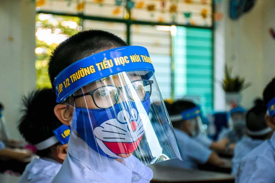 COVID-19 combat: Vietnamese students wear anti-droplet face shields returning school vietnamese students wear anti droplet face shields returning school